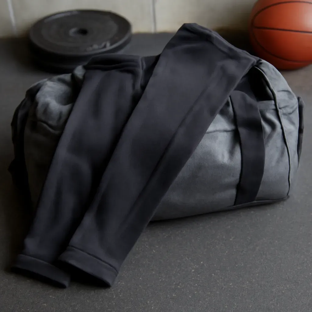 AI-generated editorial product photograph (not the exact linked listing) of compression sleeve set (arm/leg, non-medical)
